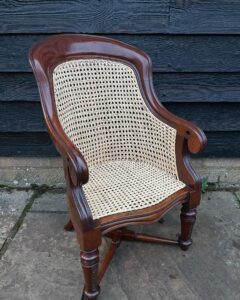 A cane childs chair